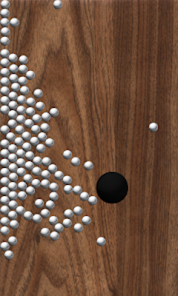 Roll Balls into a hole Image
