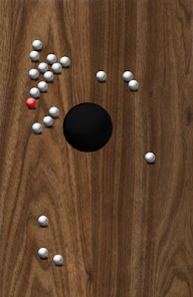 Roll Balls into a hole Image
